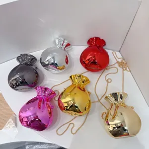 Collection of glossy metallic candy-colored evening bags with elegant gold chain strap