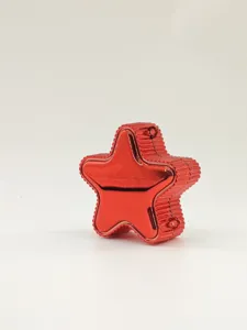 Detailed side view of a glossy red star-shaped acrylic handbag with textured edges.