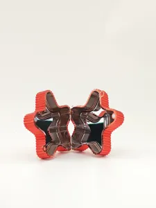 Detail view of open red star-shaped acrylic clutch bag with glossy metallic finish