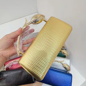 Detailed view of elegant PU evening clutch bags featuring a tulip-shaped gold handle