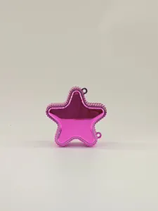 Detailed macro view of a stylish shiny pink star-shaped crossbody bag with metallic finish