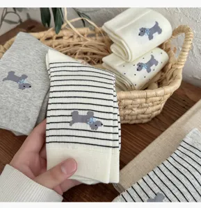 Cute women crew socks featuring grey puppy knit design, breathable cotton for spring and autumn wear.