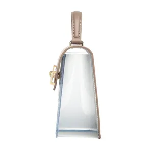 Chic transparent PVC handbag featuring brown leather trim and a gold lock side view