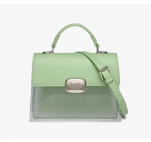 Elegante minzgrüne kleine quadratische Handtasche mit transparentem PVC-Panel und Hardware