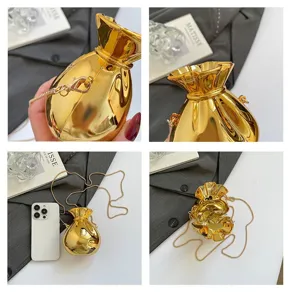 Detailed shots of the gold metallic money bag shaped acrylic evening bag with interior