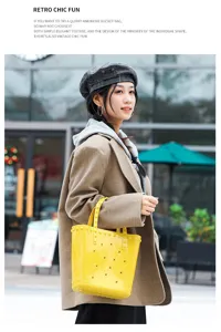 Stylish woman carrying a bright yellow perforated PVC jelly bucket bag in a city setting.
