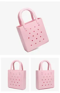 Detail view of pink waterproof PVC beach bag with breathable perforated holes design.