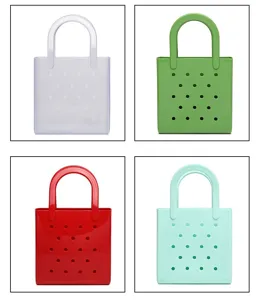 Detail view of waterproof PVC beach bags in four vibrant colors for summer storage.