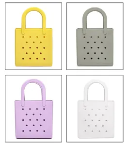 Detail view of four colorful PVC waterproof beach bags with perforated hole design