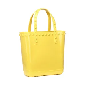 Stylish vibrant yellow PVC jelly beach bag featuring decorative rivet studs on straps.