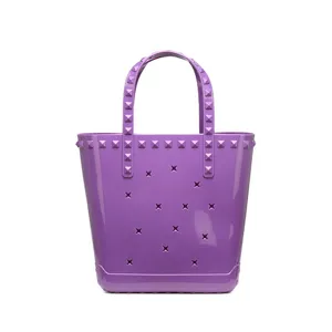 Stylish purple studded PVC jelly beach bag featuring trendy cutout star patterns