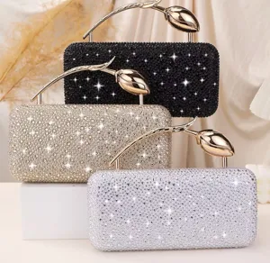 Detail view of sparkling rhinestone evening clutch bags with elegant rose flower handles