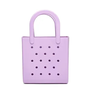 Waterproof purple PVC beach bag with perforated design for large capacity storage.