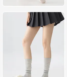 Detailed view of women's breathable athletic calf socks featuring knit mesh patterns for sports.