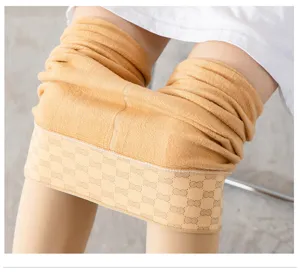 Thick fleece lined nude thermal leggings detail showing warm inner fabric and elastic waistband.