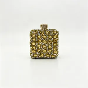 Detailed front view of a luxury gold crystal-encrusted square evening clutch bag.