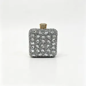 Close-up of silver rhinestone evening clutch bag with sparkling crystal embellishments