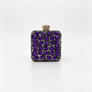 Close-up of luxurious purple square evening clutch bag with full rhinestone embellishment