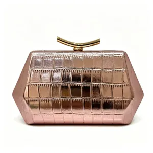 Rose gold hexagonal evening clutch bag with crocodile skin texture and gold clasp.