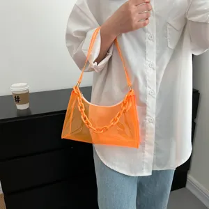 Transparent orange PVC underarm jelly bag with chunky chain detail and shoulder strap