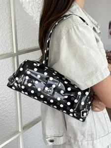 Stylish black and white polka dot PVC underarm bag with a glossy finish for women