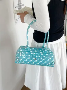 Stylish light blue transparent PVC underarm bag featuring white polka dots and long straps