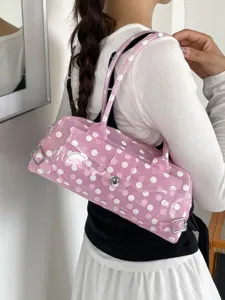 Trendy pink polka dot PVC jelly shoulder bag for women in a stylish underarm design.
