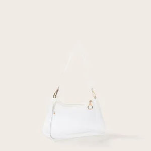 Zijaanzicht van een transparante PVC jelly okseltas met elegante witte riemdetails.