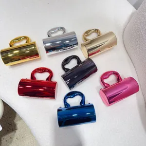 Collection of various candy-colored mini acrylic evening bags with a glossy metallic finish.