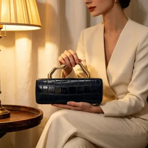 Elegant vintage crocodile pattern evening clutch bag with a unique gold wavy handle design