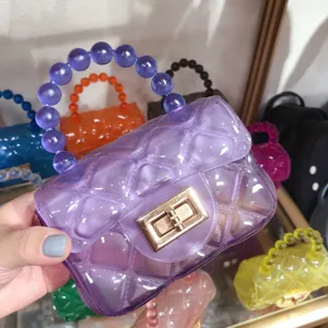 Detail view of purple transparent quilted mini jelly bag featuring a beaded handle