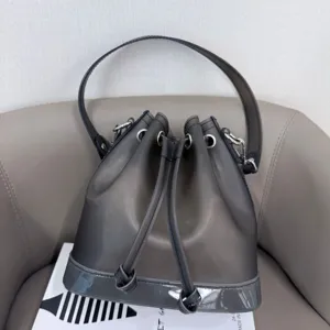 Close-up detail of grey frosted TPU jelly bucket bag featuring a drawstring closure