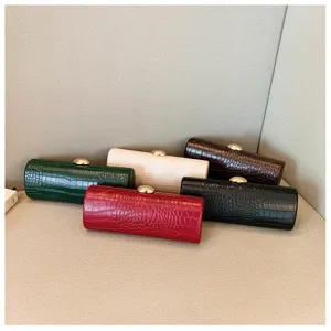 A collection of retro crocodile pattern baguette clutch bags in five elegant colors.