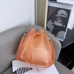 Close-up detail of a stylish apricot frosted TPU jelly bucket bag with drawstring closure.