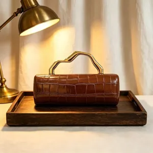 Elegant brown crocodile pattern PU evening clutch bag featuring a gold sculptural handle