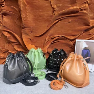 Multiple colors of frosted TPU jelly bucket bags shown with drawstring and straps