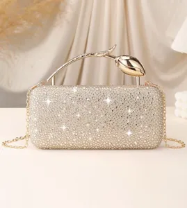 Detail view of luxury rhinestone evening clutch bag with elegant rose flower handle