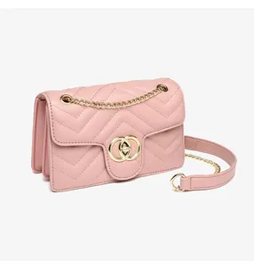 Close-up of pink chevron quilted chain bag with gold interlocking circle clasp.