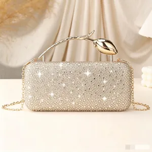 Elegant champagne rhinestone evening clutch bag featuring a unique golden rose bud handle