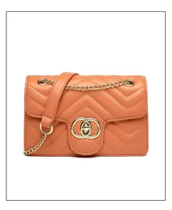 Close-up of orange quilted cross-body bag featuring a gold interlocking buckle