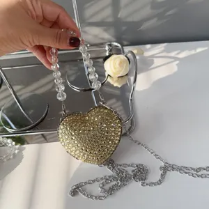 Detailed view of luxury heart-shaped mini bag with sparkling rhinestones and beads