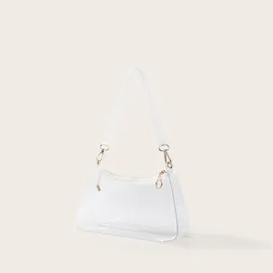 Minimalistische transparante PVC okseltas met witte bies en goudkleurige details