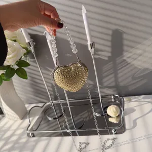 Elegant heart-shaped mini lipstick bag with sparkling rhinestones and clear beaded handle