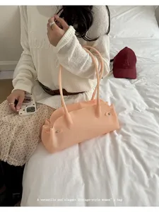 Vintage-style peach jelly tote bag held by a model in a cozy lifestyle bedroom setting