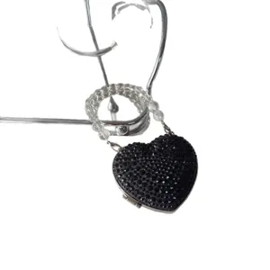 Elegant heart-shaped mini lipstick bag with black rhinestones and clear beaded chain strap