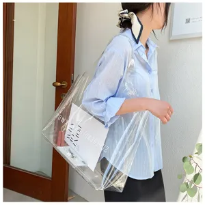 Detail view of large transparent PVC tote bag shown in a lifestyle commuter setting