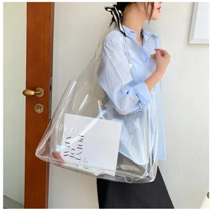 Side view showing the transparency and large capacity of a clear PVC jelly tote bag