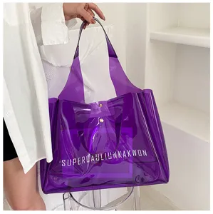 Close-up of a large purple transparent PVC jelly tote bag with bold white lettering