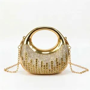 Front view of golden crescent evening bag with shimmering rhinestone gradient design