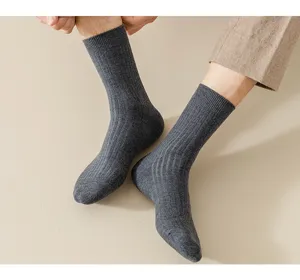 Men's dark grey ribbed knit wool crew socks detail shot showing comfortable texture and fit.